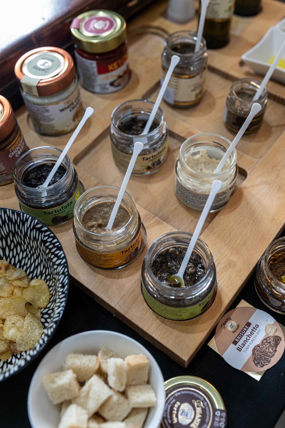 Truffle product tasting counter inside Zigante Tartufi truffle shop in Motovun, Istria, Croatia, with oils, sauces, spreads, and samples