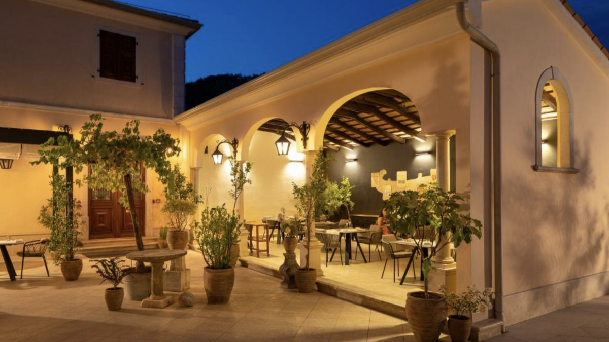 Terrace of the Zigante Restaurant in Livade at dusk