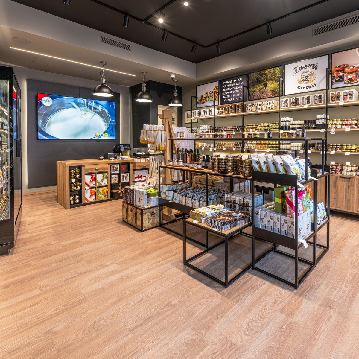 Zigante Tartufi truffle shop interior in Buje, Istria, Croatia, with shelves of truffle products and gourmet gifts.