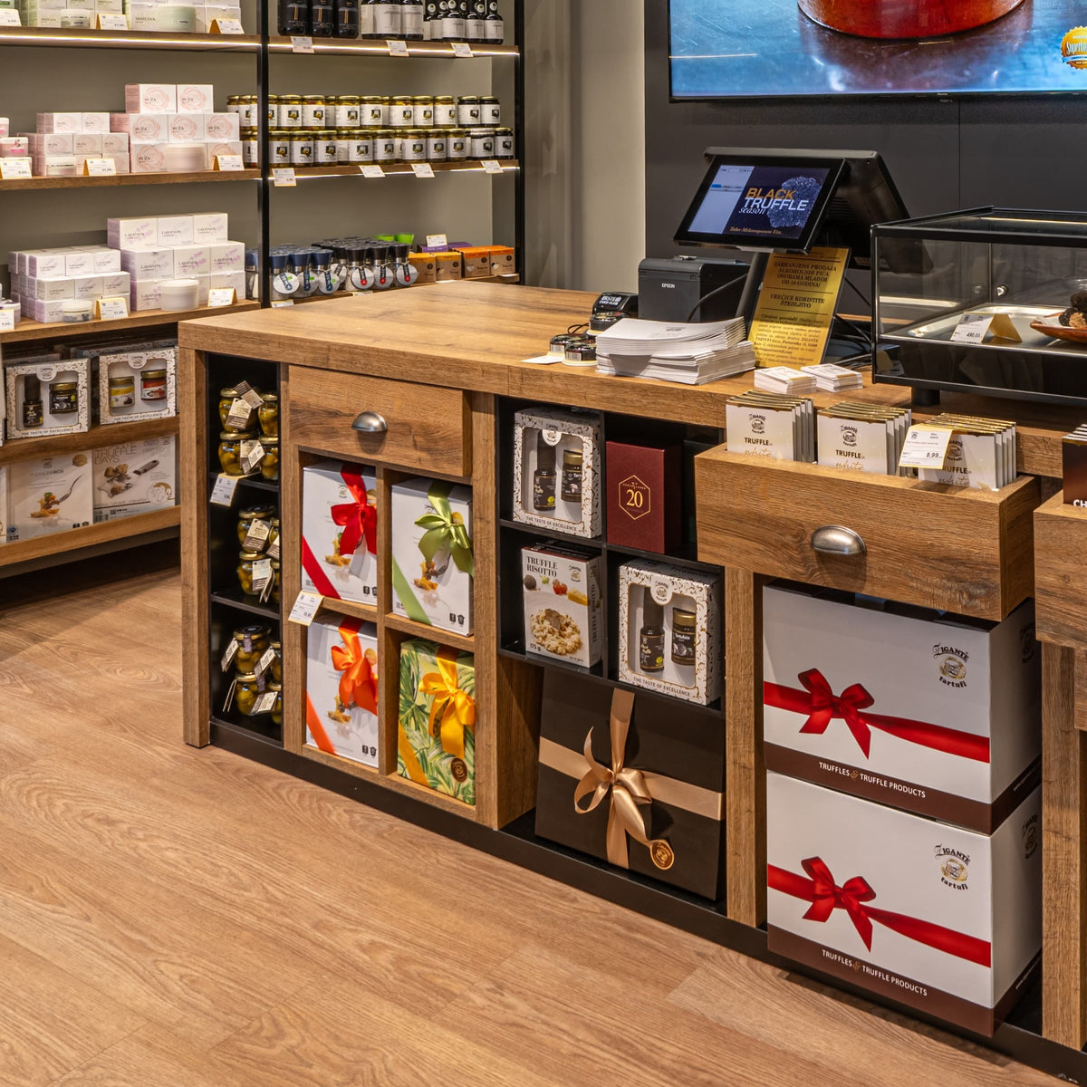 Truffle gift boxes and gourmet products displayed inside Zigante Tartufi truffle shop in Buje, Istria, Croatia